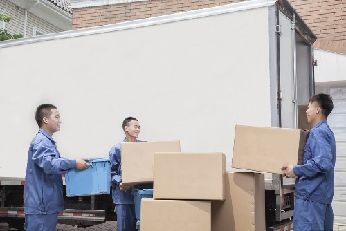 Local removal team loading boxes for a flat move in Clapham