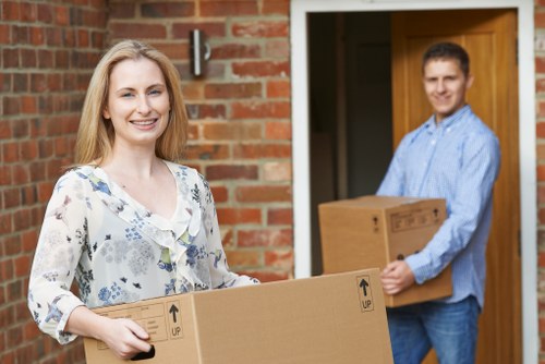 Local moving team preparing packed boxes for collection in Clapham
