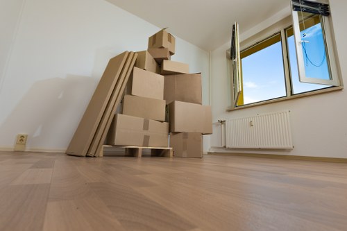 Professional movers handling furniture on a same day Clapham move