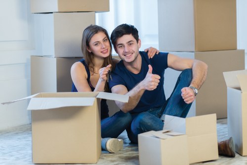 Careful packing of fragile belongings in a Clapham home