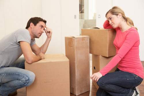 Furniture being carefully moved from a Clapham flat with stair access